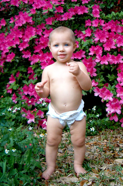 Toddler wearing a flat diaper with snappi.